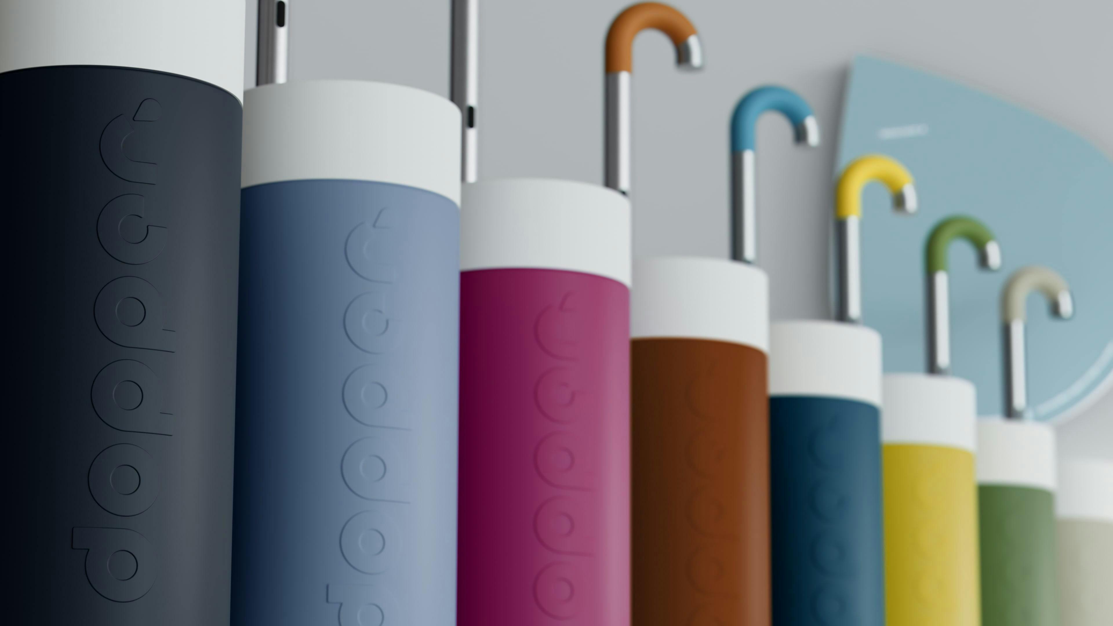 A line up of 6 coloured Dopper Water Taps